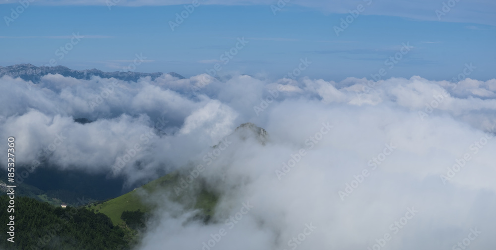 Sky and sea of clouds with Mount Ausa Gaztelu in Basque Country