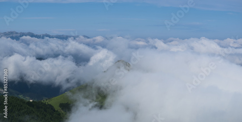 Sky and sea of clouds with Mount Ausa Gaztelu in Basque Country