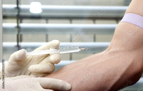 Man receiving injection in arm
