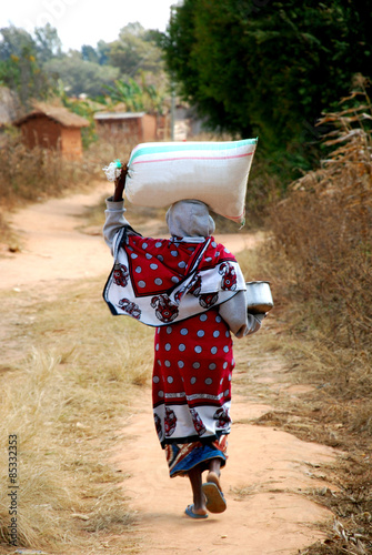 African woman with a sack of flour on his head - Pomerini - Tanz photo