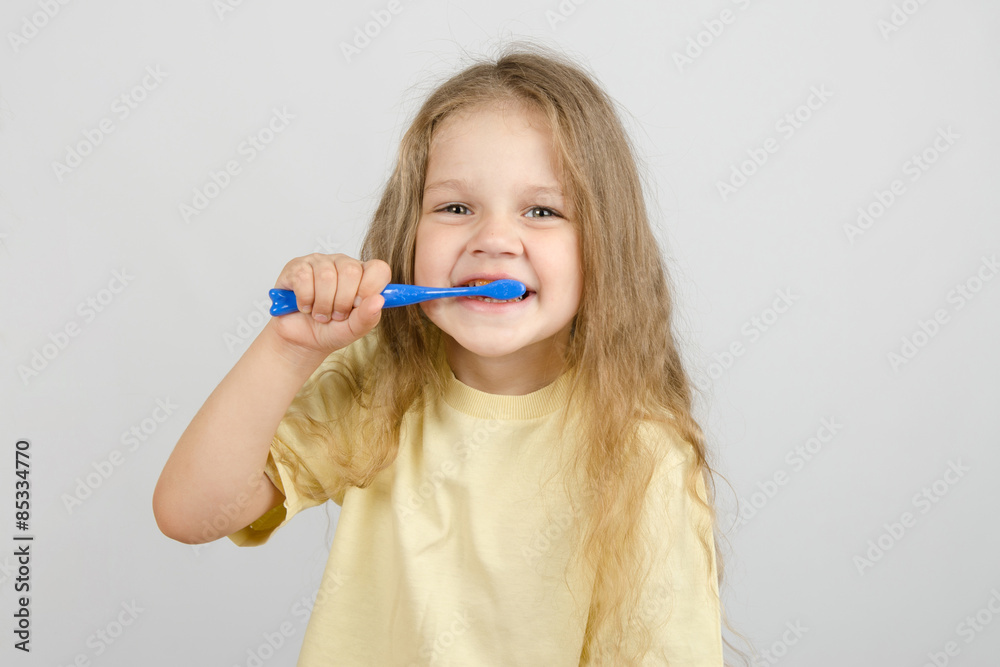 Four-year girl brushing her teeth Four-year girl brushing her teeth