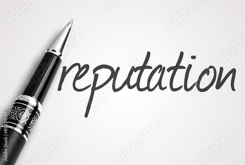 pen writes reputation word on paper