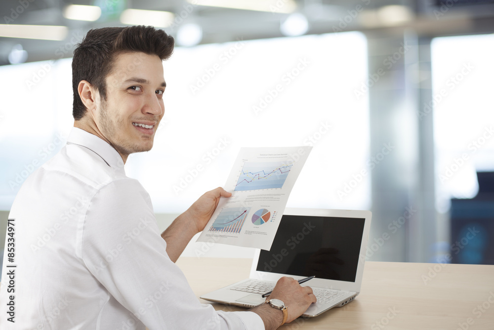 Businessman sitting table and holding document