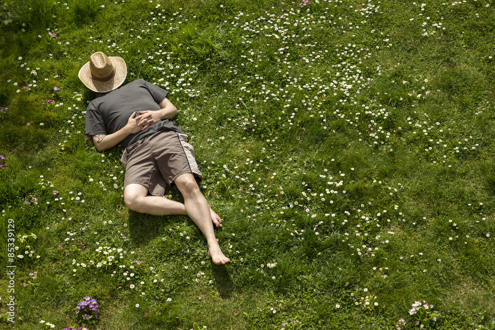 Man lying in grass relaxing