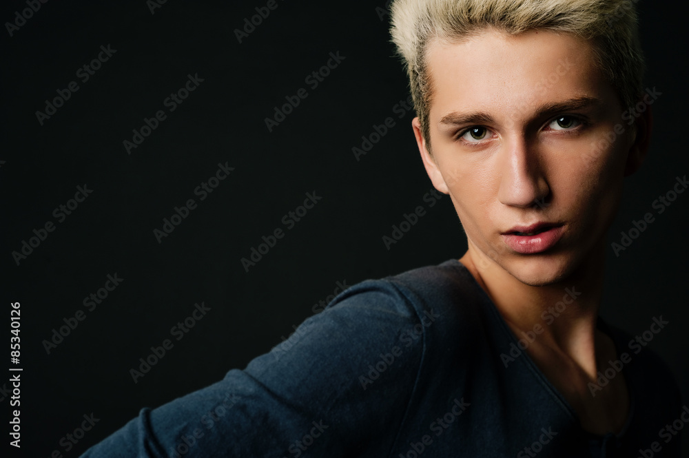 dressed casually in a studio on a black background close-up and copyspace