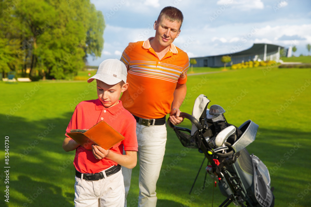 Fototapeta premium Father with son at golf