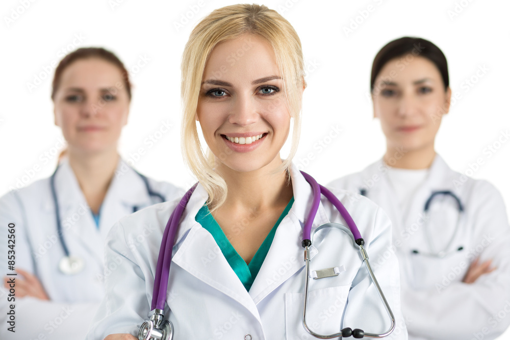 Portrait of female doctor surrounded by medical team Portrait of female doctor surrounded by medical team