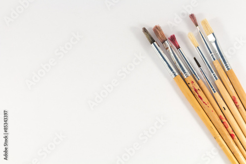 red pens drive focus to center on wooden background