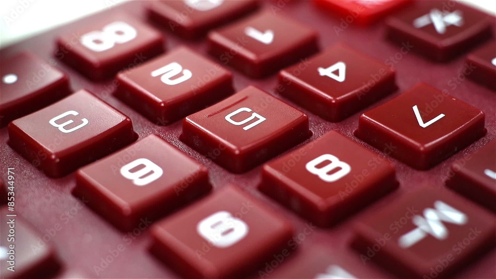 woman finger pushing calculator buttons, extra close up woman finger pushing calculator buttons, extra close up