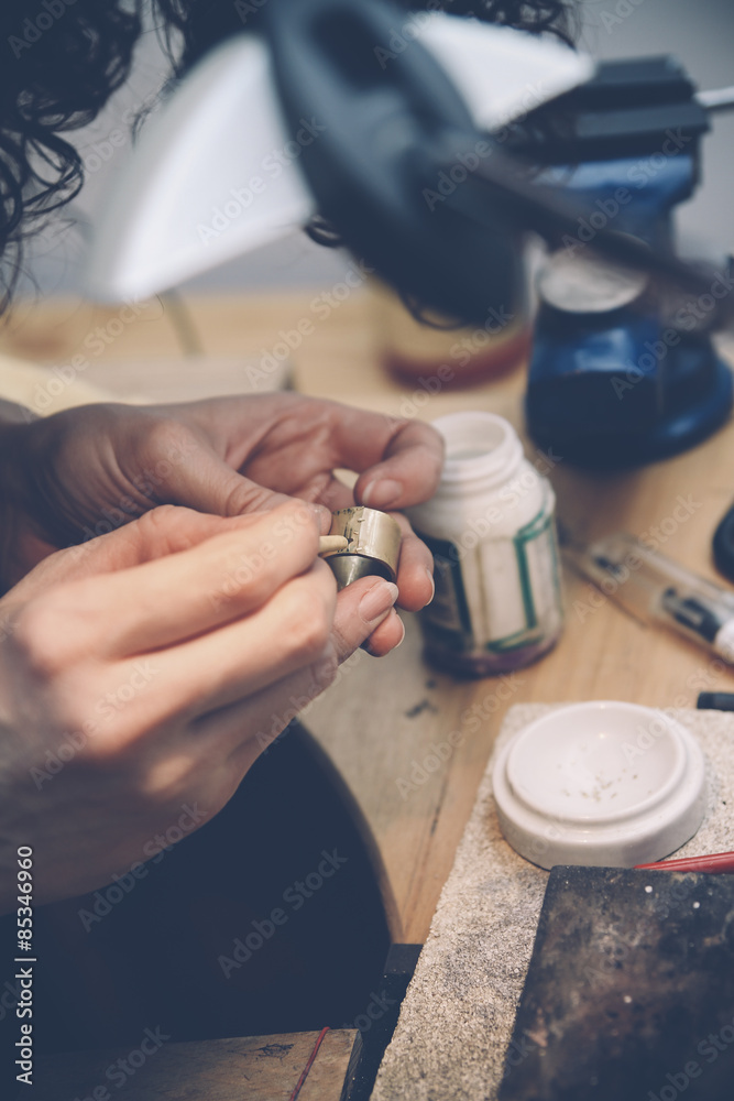 Goldsmith working on wedding rings Goldsmith working on wedding rings