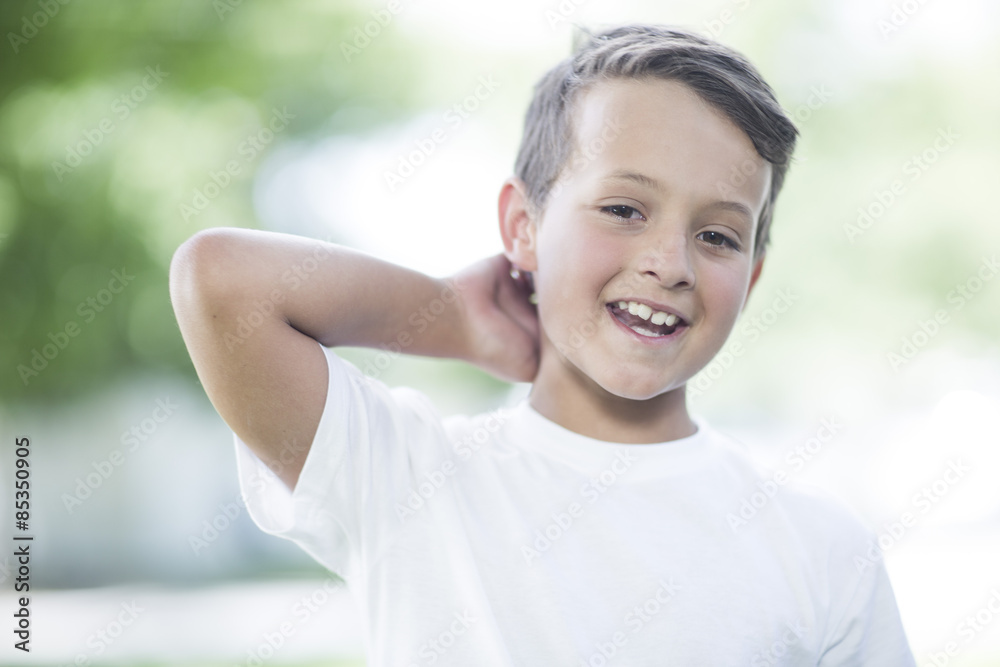 Portrait of smiling boy with hand behind his head Portrait of smiling boy with hand behind his head