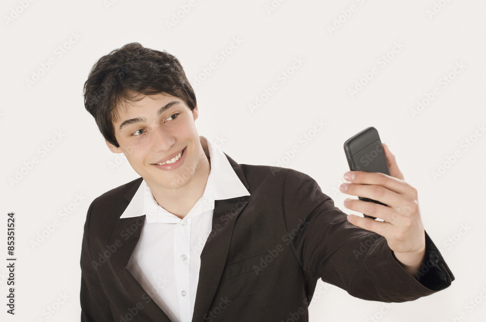 Happy businessman taking a selfie photo with his smart phone. Elegant man holding mobile phone. Happy businessman taking a selfie photo with his smart phone. Elegant man holding mobile phone.