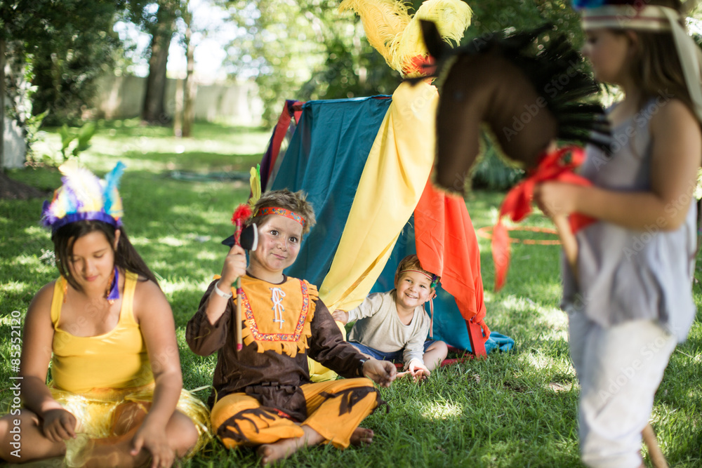 Kids In Garden Playing Cowboys And Indians Stock Foto Adobe Stock