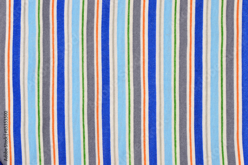 Blue striped background. Colorful vertical stripes fabric pattern.