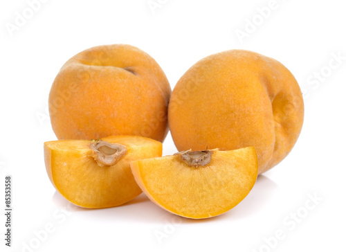  ripe yellow peach on white background