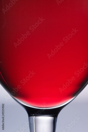 The close up of the red wine glass