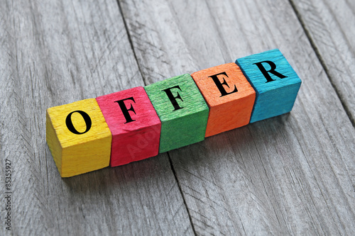 word offer on colorful wooden cubes photo