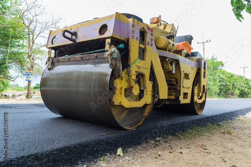 Heavy Vibration roller compactor at asphalt pavement works for road repairing