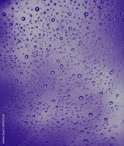 Waterdrops on a glass surface abstract nature background