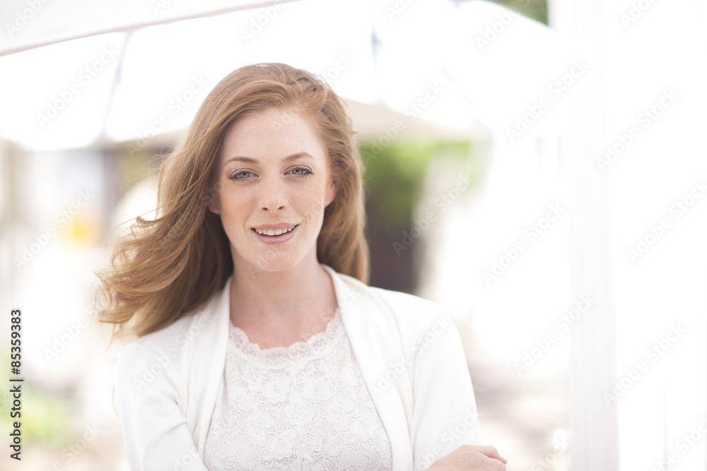 Portrait of smiling young woman outdoors Portrait of smiling young woman outdoors