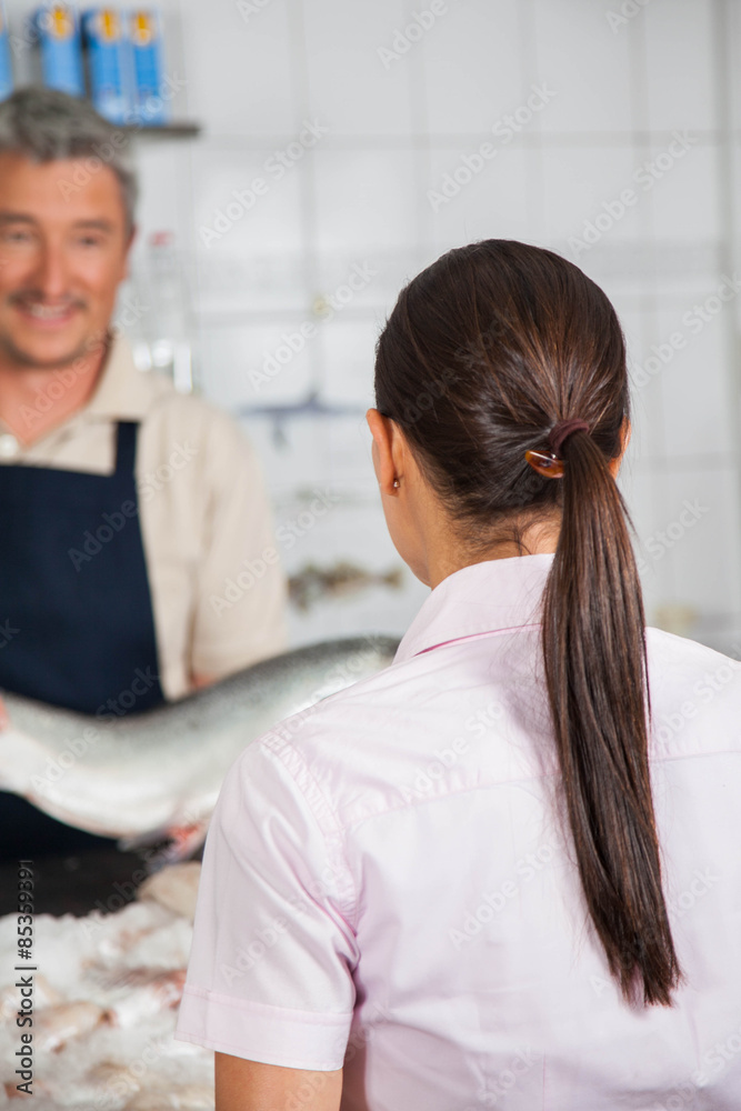 Fototapeta premium Woman buying in a fish shop