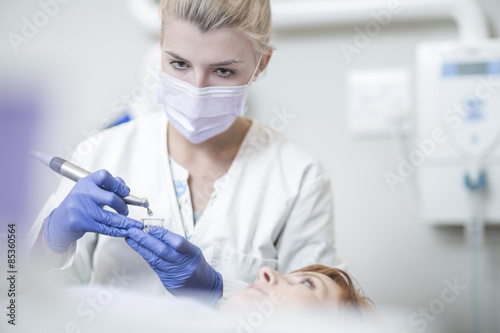 Dentist using amalgam carrier photo