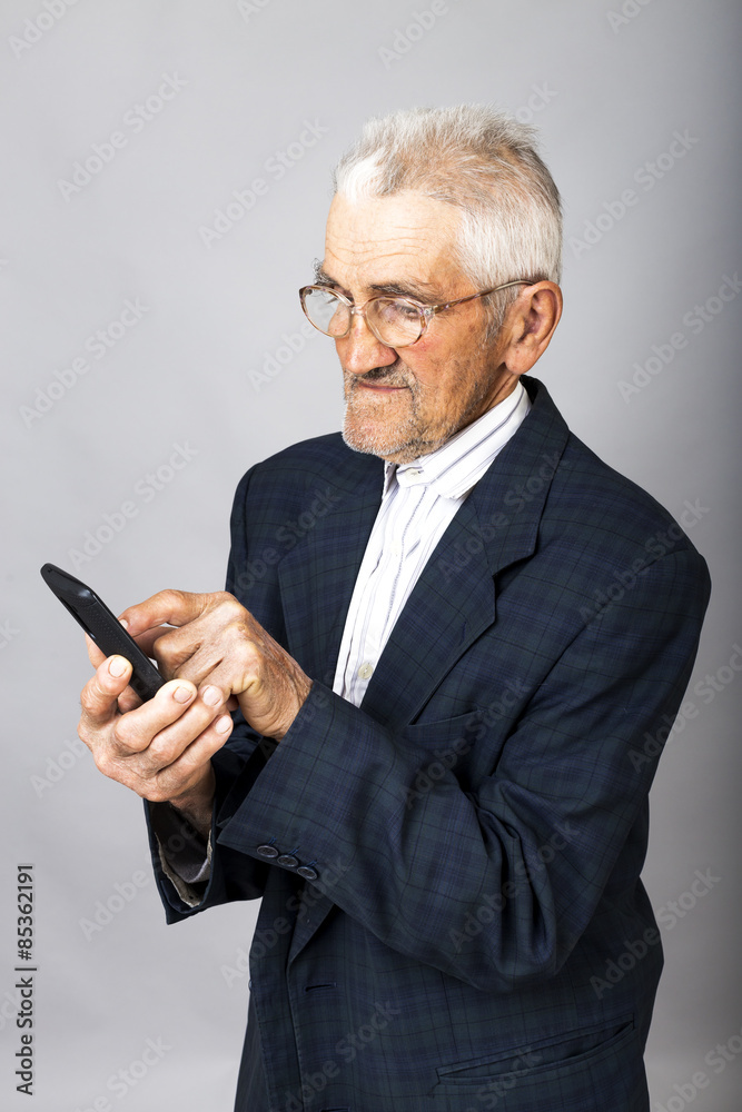 Portrait of an elderly man using mobil phone Portrait of an elderly man using mobil phone