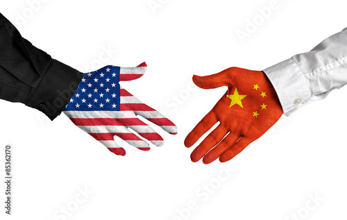 Canvas Print American and Chinese leaders shaking hands on a deal agreement