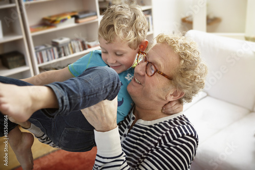 Grandfather and grandson playing at home