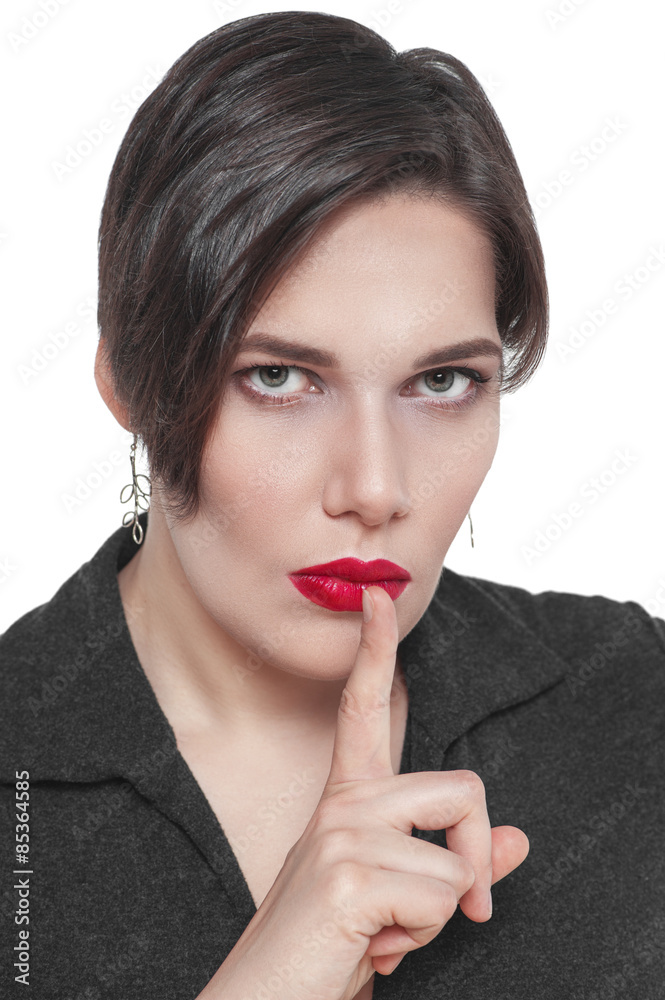 Beautiful plus size woman with finger on lips isolated Beautiful plus size woman with finger on lips isolated