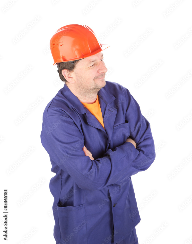 Man in working clothes with crossed arms.