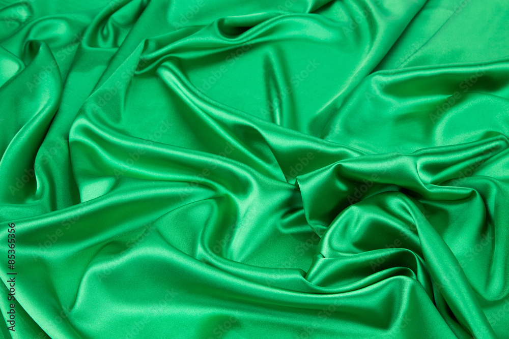 Fototapeta premium Green silk cloth with soft folds.
