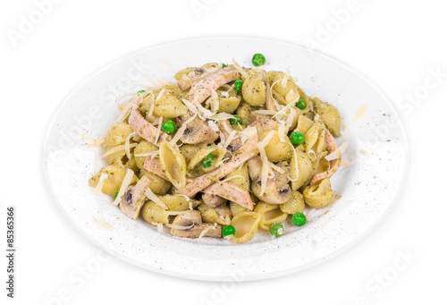 Pasta shells with vegetables and sausage cheese.