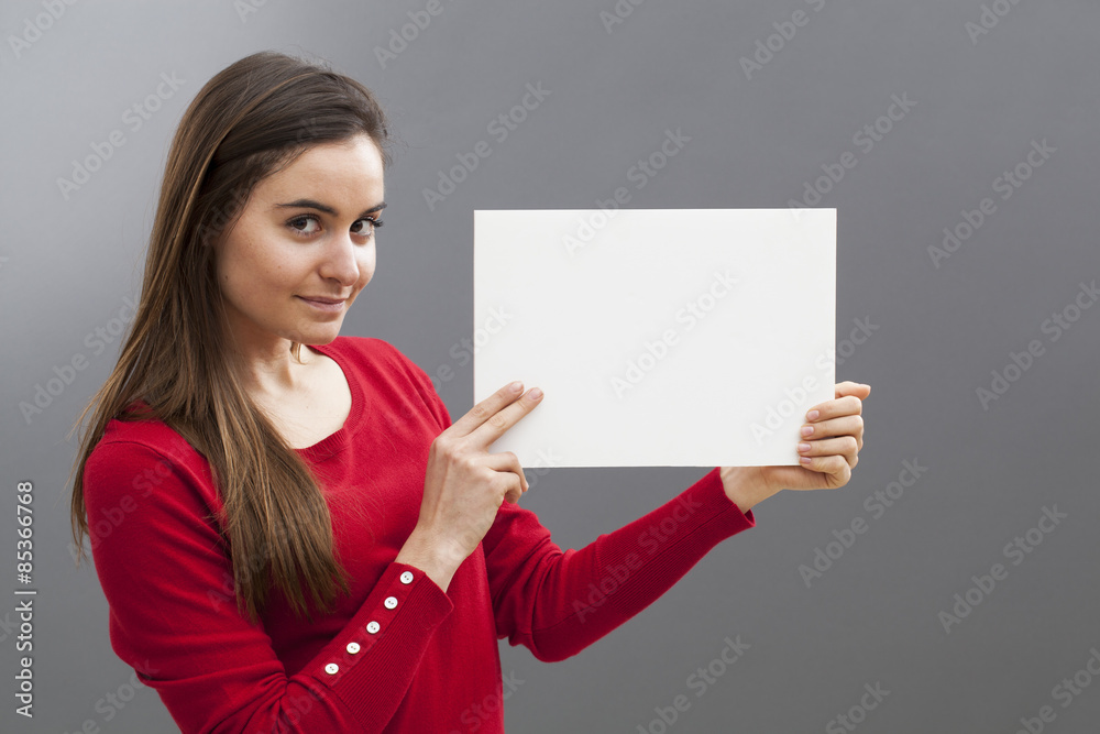 smiling young brunette wearing red holding a blank communication board with teasing news on smiling young brunette wearing red holding a blank communication board with teasing news on