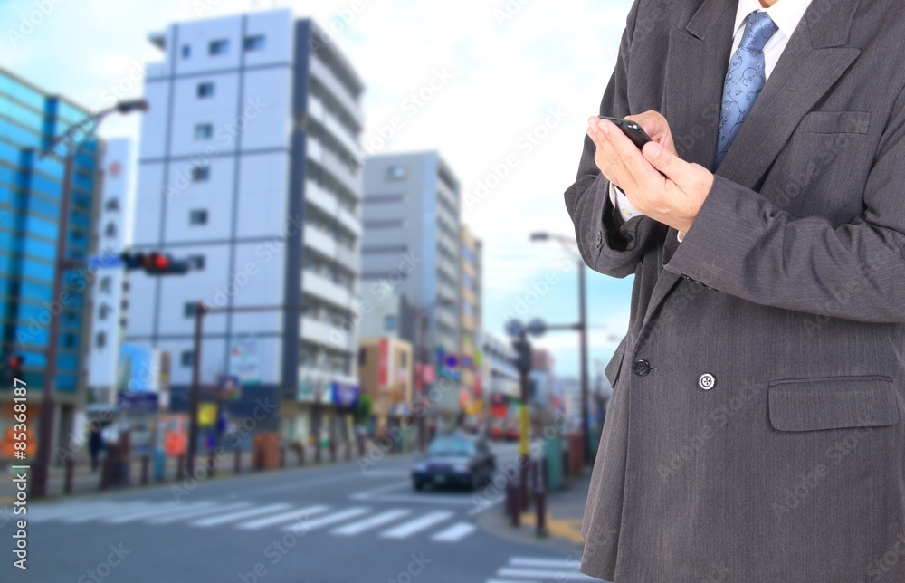 Double exposure of city and business man