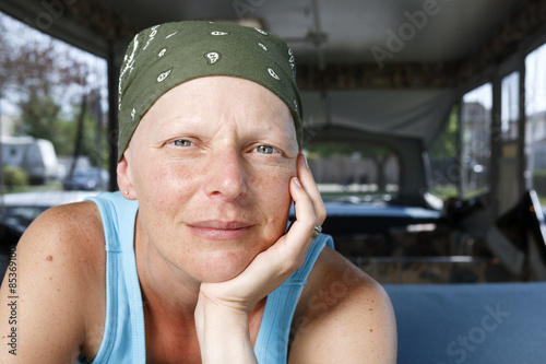 Portrait of a woman fighting breast cancer wearing a bandana.