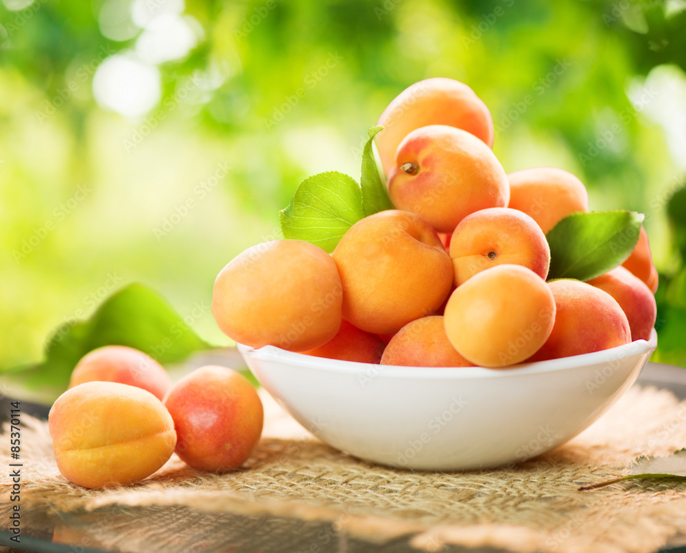Apricot. Ripe organic apricots on a wooden table Apricot. Ripe organic apricots on a wooden table