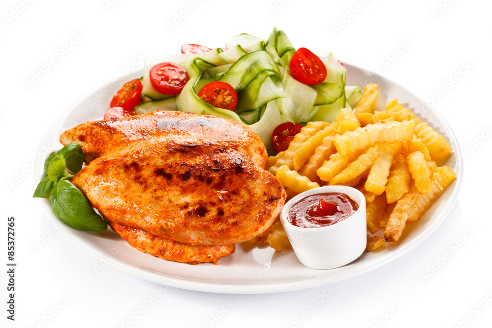 Fried chicken fillet, chips and vegetable salad Fried chicken fillet, chips and vegetable salad