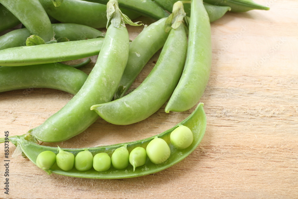 fresh beans broad over wood background, selective focus