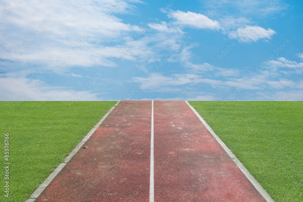 Obraz premium Running track over blue sky and clouds