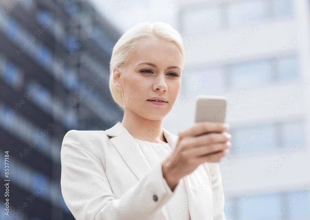 serious businesswoman with smartphone outdoors serious businesswoman with smartphone outdoors