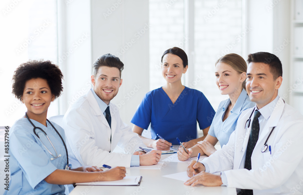 group of happy doctors meeting at hospital office group of happy doctors meeting at hospital office