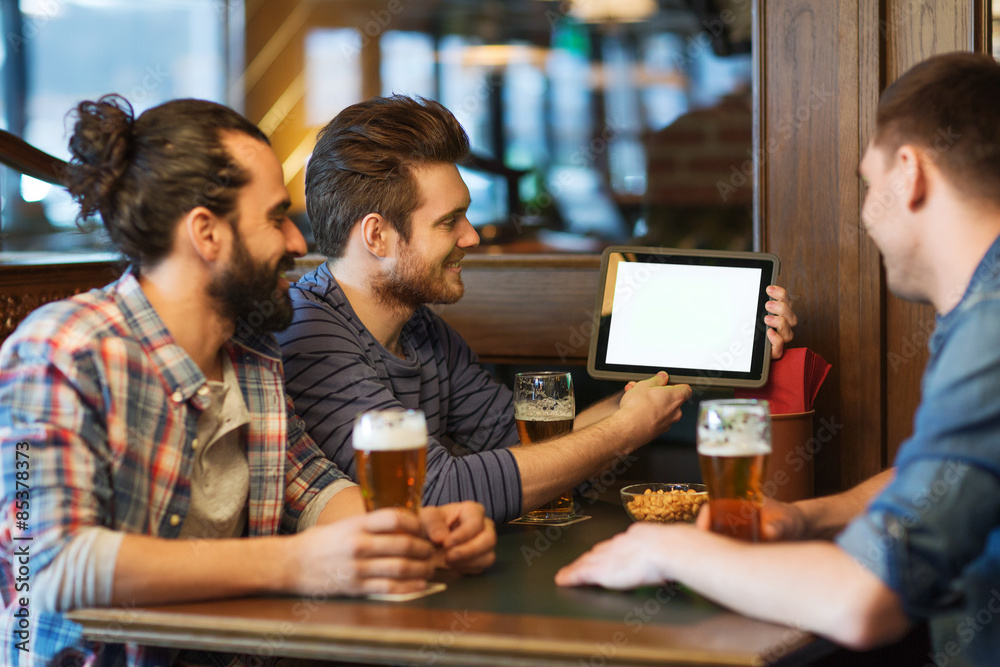 male friends with tablet pc drinking beer at bar male friends with tablet pc drinking beer at bar