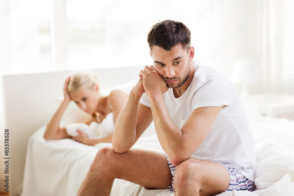 Photography unhappy couple having problems at bedroom