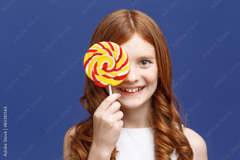 Pretty girl holding lollipop 