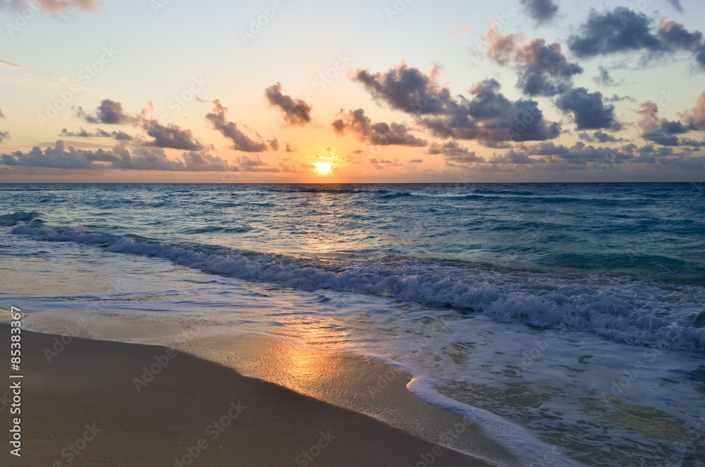 Golden sunrise from blue sea