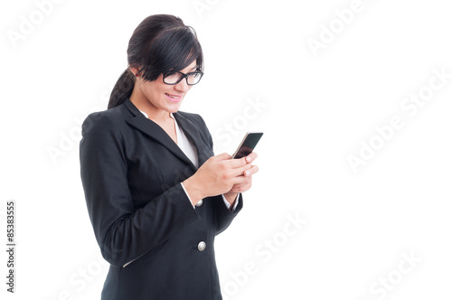 Saleswoman texting on smartphone