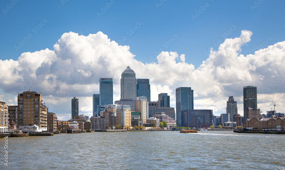 LONDON, UK - APRIL 30, 2015: Canary Wharf business aria view from the River Thames LONDON, UK - APRIL 30, 2015: Canary Wharf business aria view from the River Thames