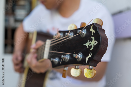 Man Playing acoustic guitar