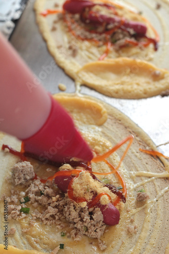 Making pancake on a hot stove